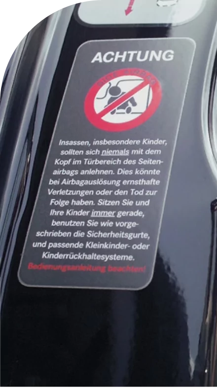 A high quality custom label displaying a no riding sign affixed to the back of a motorcycle.