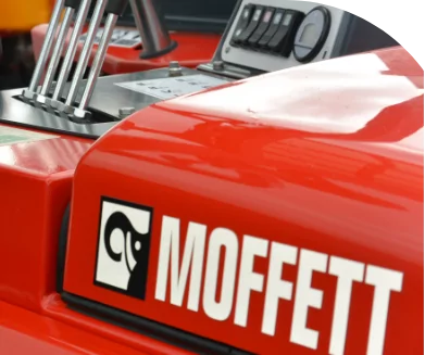 A customized red truck with the word Moffett on it.
