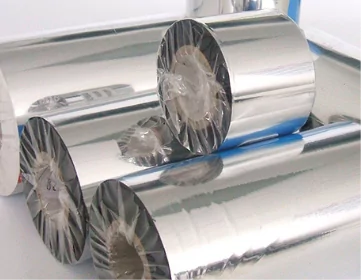 A roll of custom silver foil labels on a white surface.