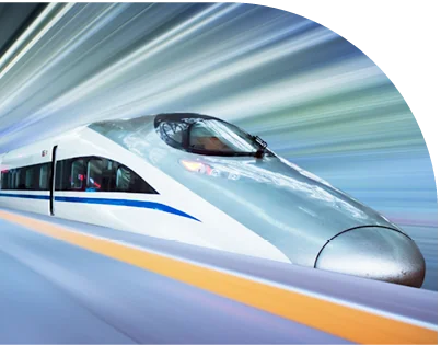 A modern high-speed train travels rapidly on tracks, with a motion blur effect in the background suggesting fast movement.